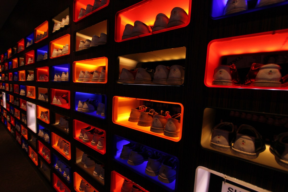 plain shoes in colorful cupboards